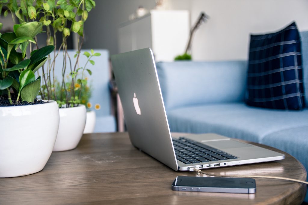 laptop on top of a coffee table
