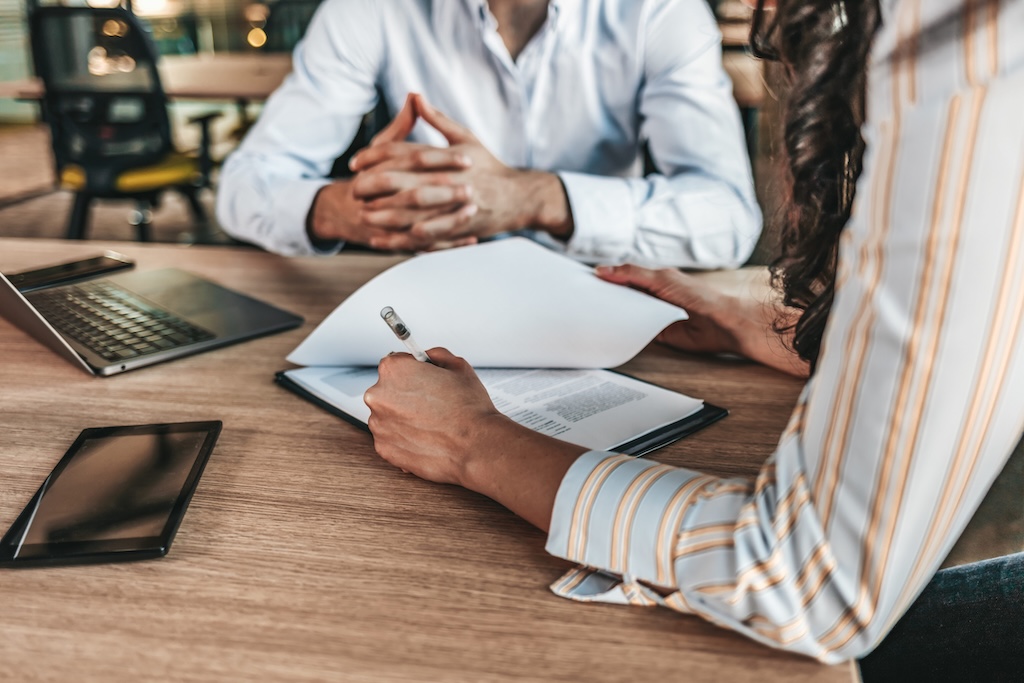 two landlords working together at a table