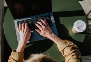 overhead visual of a landlord working on a laptop