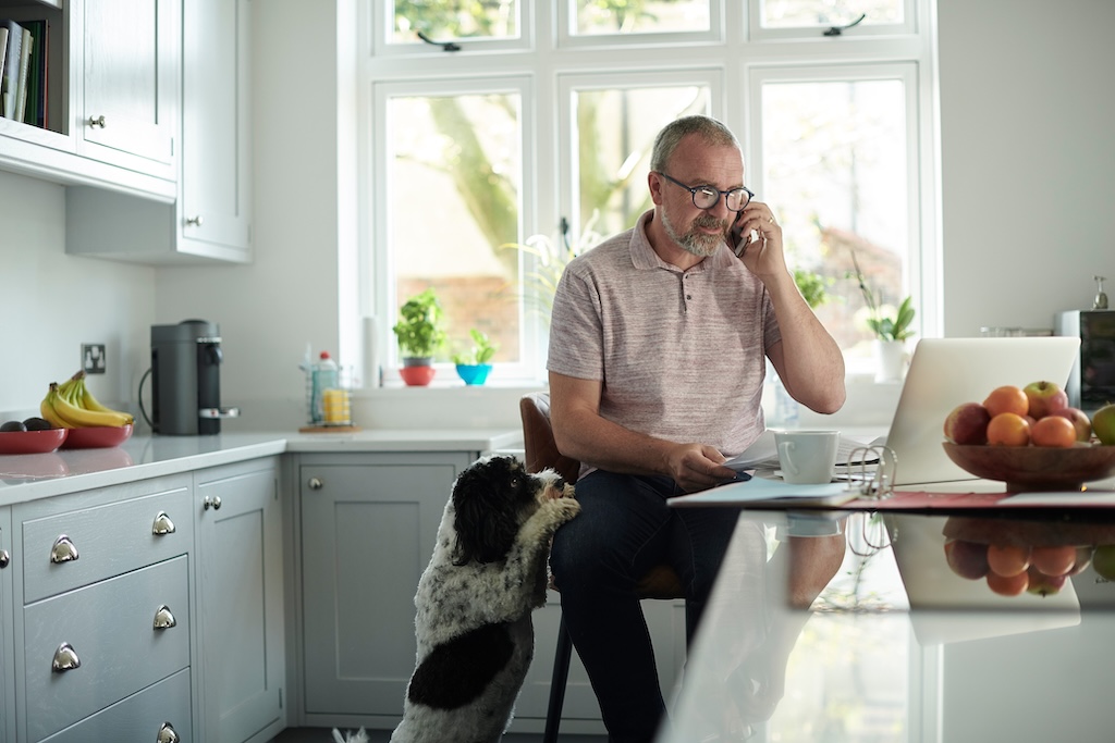 landlord communicating with a tenant on his phone