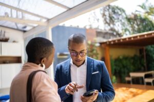 two landlords having a discussion outside