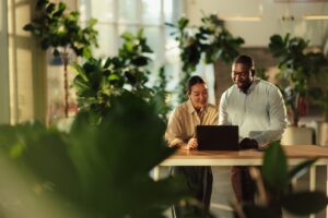 two landlords reviewing rental property expenses for taxes