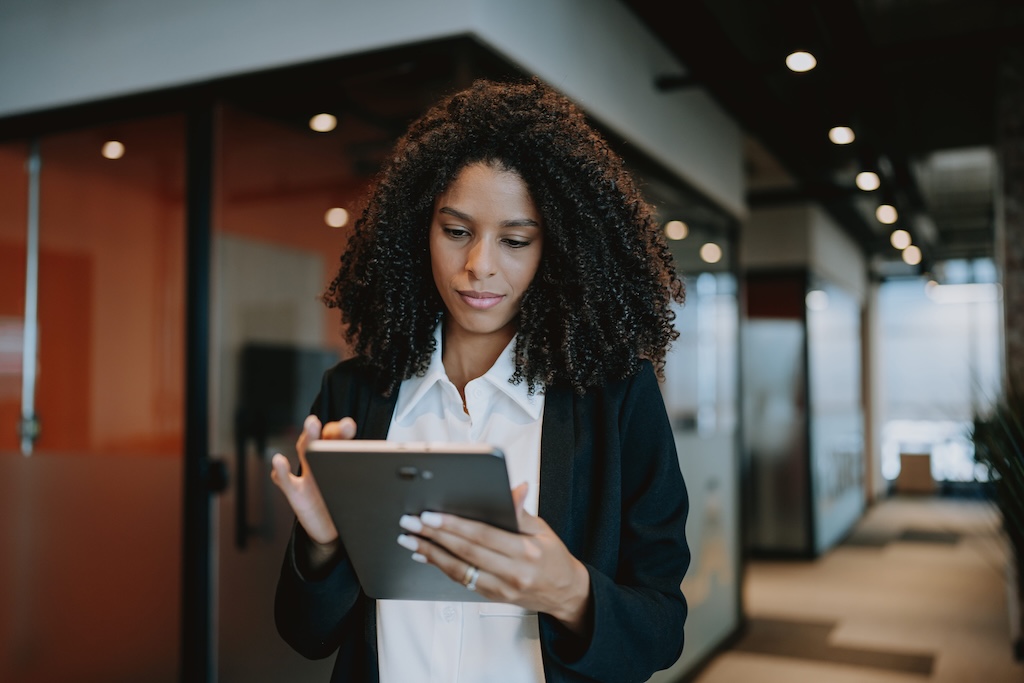 landlord reviewing a rental application on their tablet